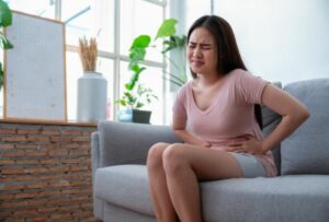 Young Woman Feeling Abdominal Pain