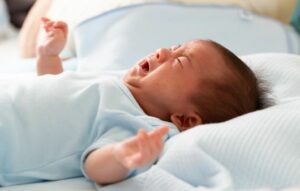Asian baby newborn crying from diarrhea colic symptoms